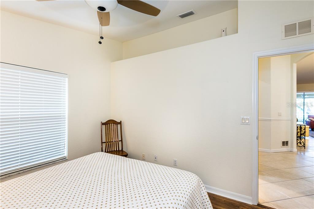 3800 Tripoli Boulevard, Unit 35 Punta Gorda, FL 33950 - Photo 39 of 44 a bedroom with a bed and a table