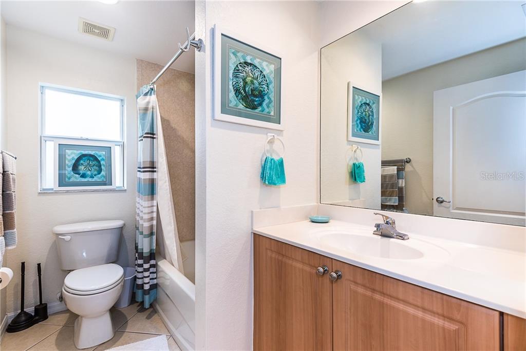 3800 Tripoli Boulevard, Unit 35 Punta Gorda, FL 33950 - Photo 40 of 44 a bathroom with a sink a toilet and a mirror