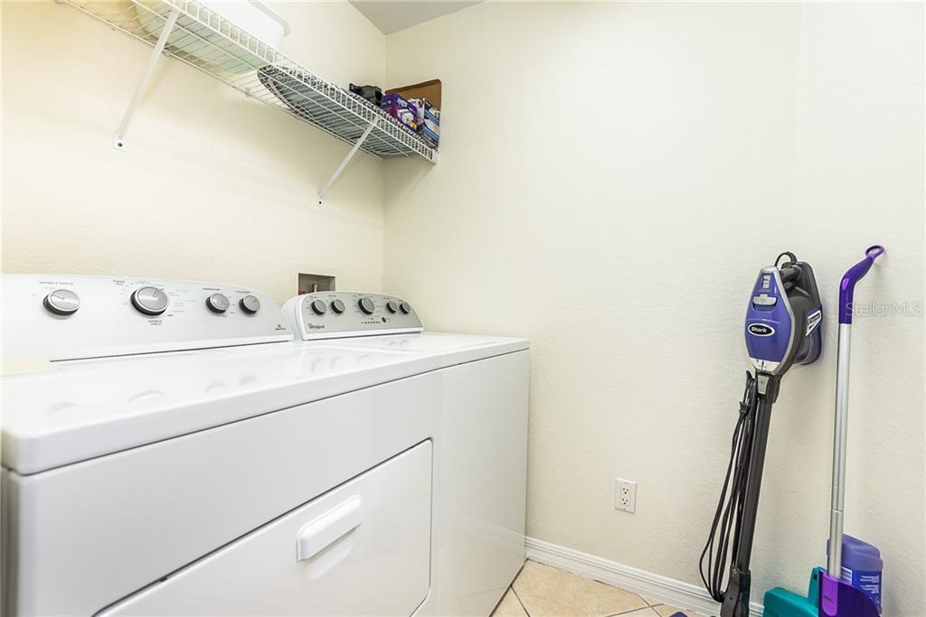 3800 Tripoli Boulevard, Unit 35 Punta Gorda, FL 33950 - Photo 42 of 44 a utility room with dryer and washer