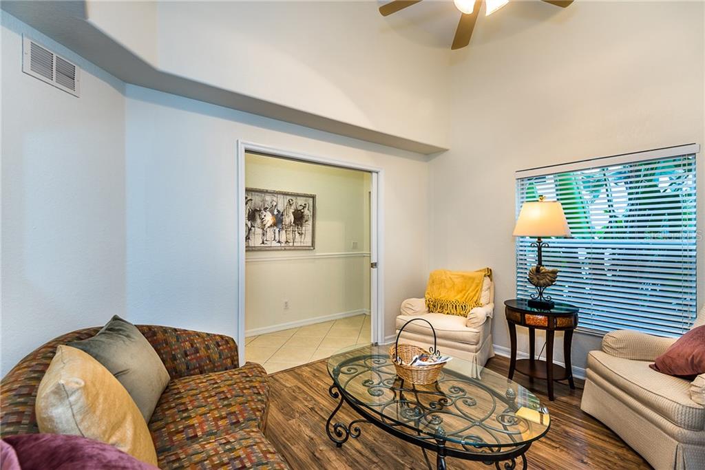 3800 Tripoli Boulevard, Unit 35 Punta Gorda, FL 33950 - Photo 5 of 44 a living room with furniture and wooden floor