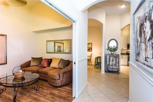 a living room with furniture and a clock