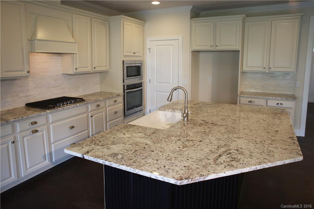 1026 Emory Lane, Unit 74 Fort Mill, SC 29708 - Photo 2 of 23 a kitchen with white cabinets and sink