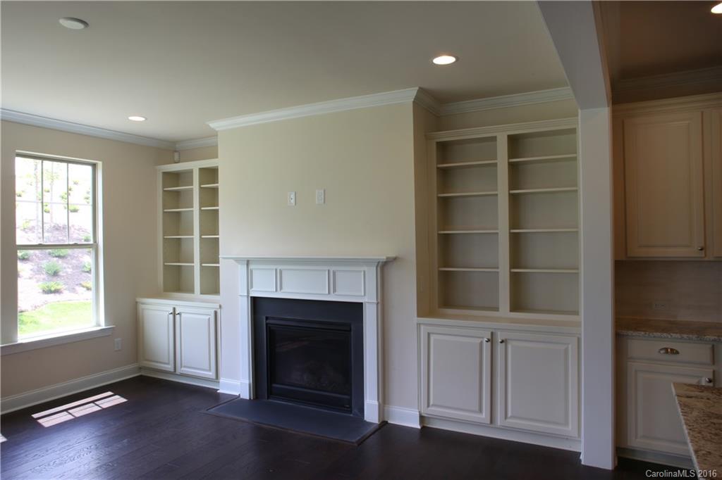 1026 Emory Lane, Unit 74 Fort Mill, SC 29708 - Photo 11 of 23 a living room with a fireplace cabinet and a large window