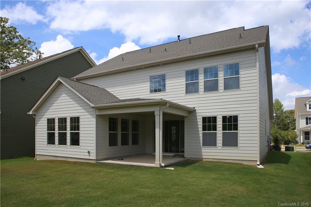1026 Emory Lane, Unit 74 Fort Mill, SC 29708 - Photo 12 of 23 a front view of a house with a garden
