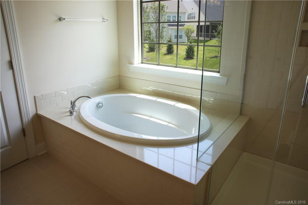 1026 Emory Lane, Unit 74 Fort Mill, SC 29708 - Photo 13 of 23 a bathroom with a tub and window