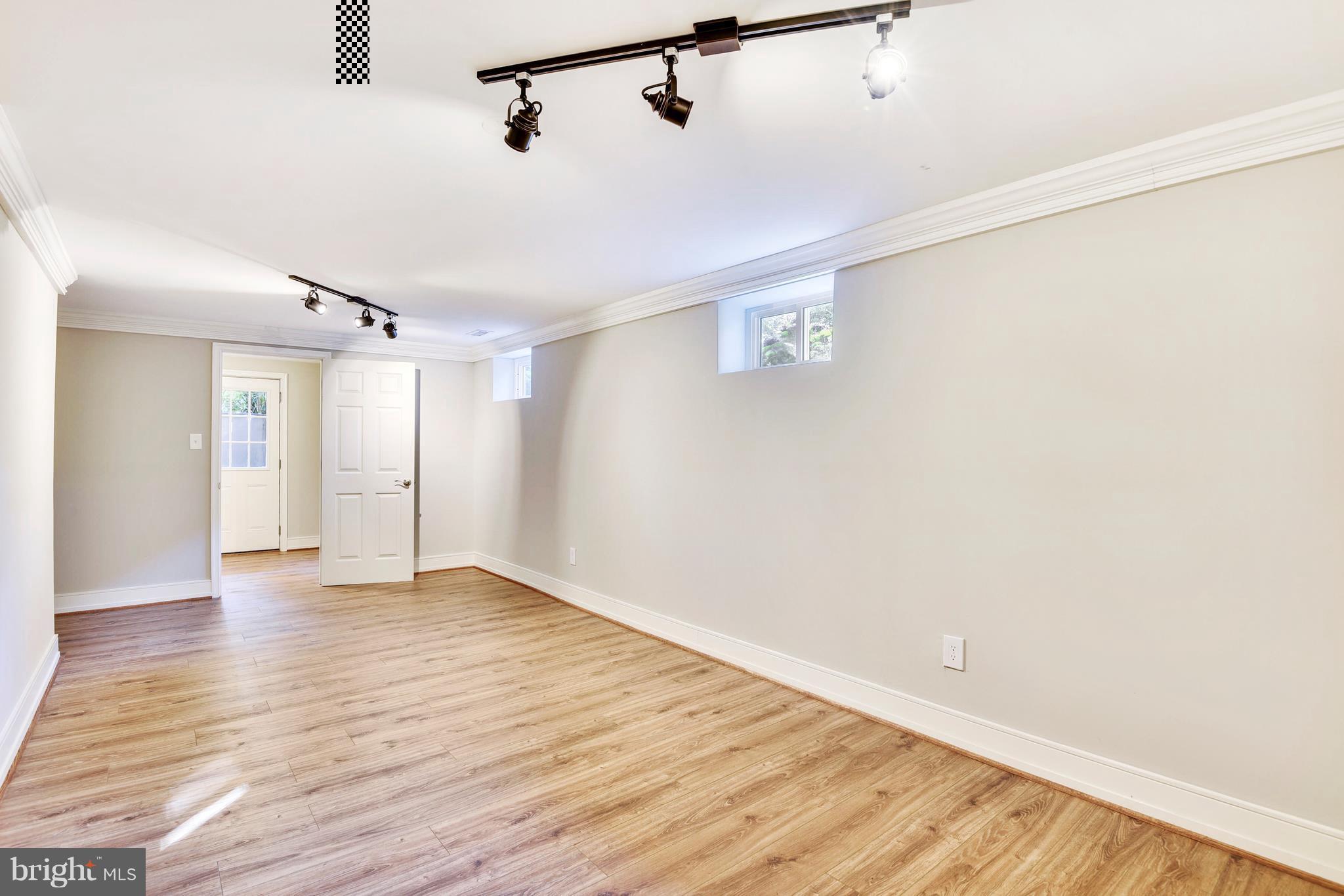 4017 Olney Laytonsville Road Olney, MD 20832 - Photo 12 of 28 a view of an empty room with wooden floor