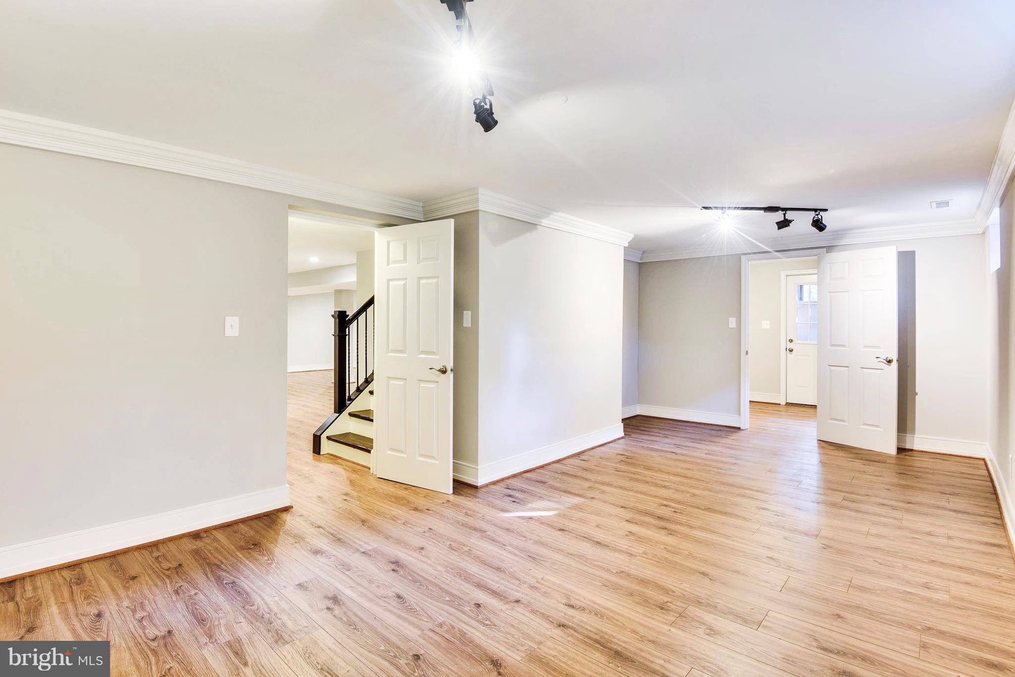 4017 Olney Laytonsville Road Olney, MD 20832 - Photo 17 of 28 a view of empty room with wooden floor