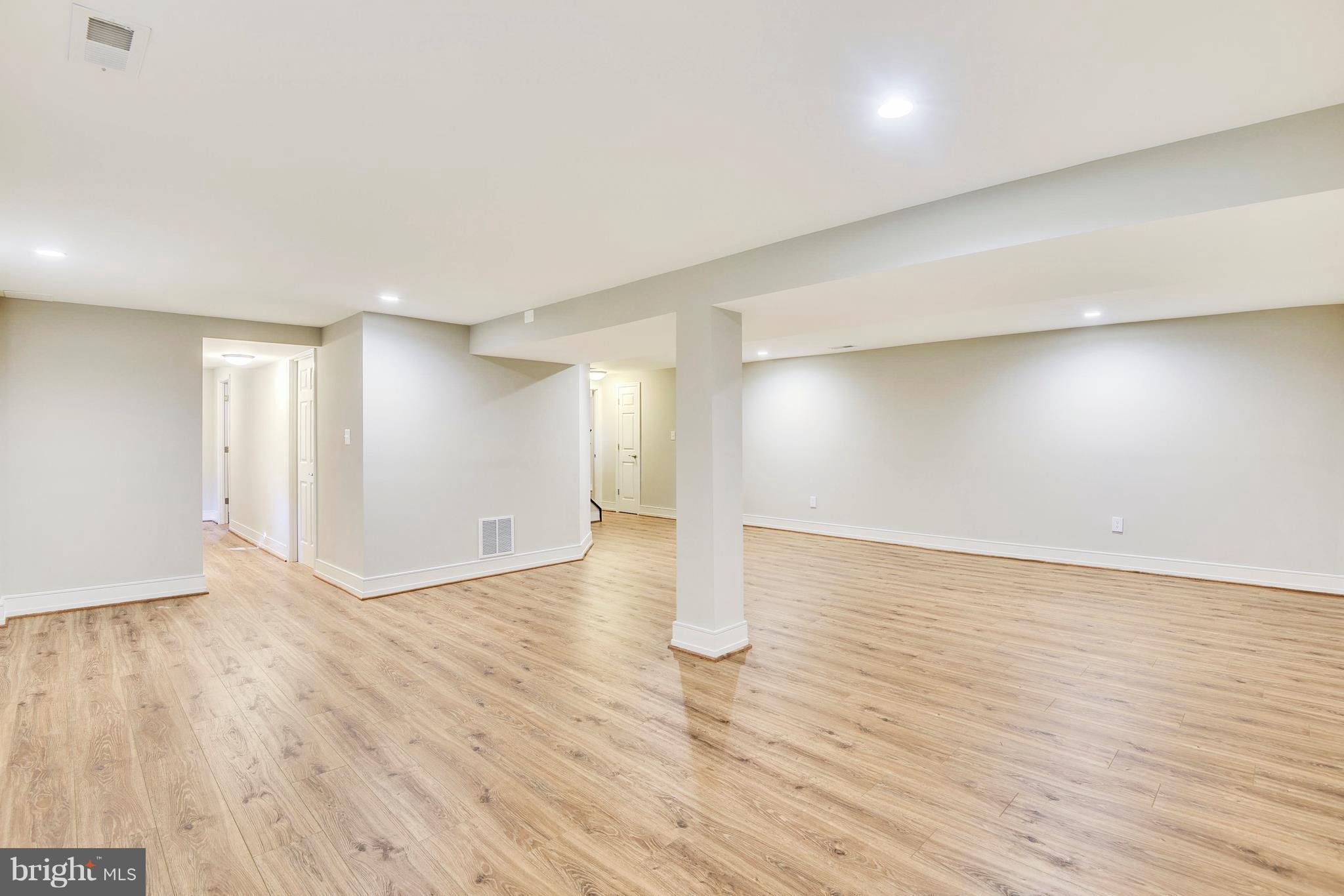 4017 Olney Laytonsville Road Olney, MD 20832 - Photo 19 of 28 wooden floor in an empty room with a window