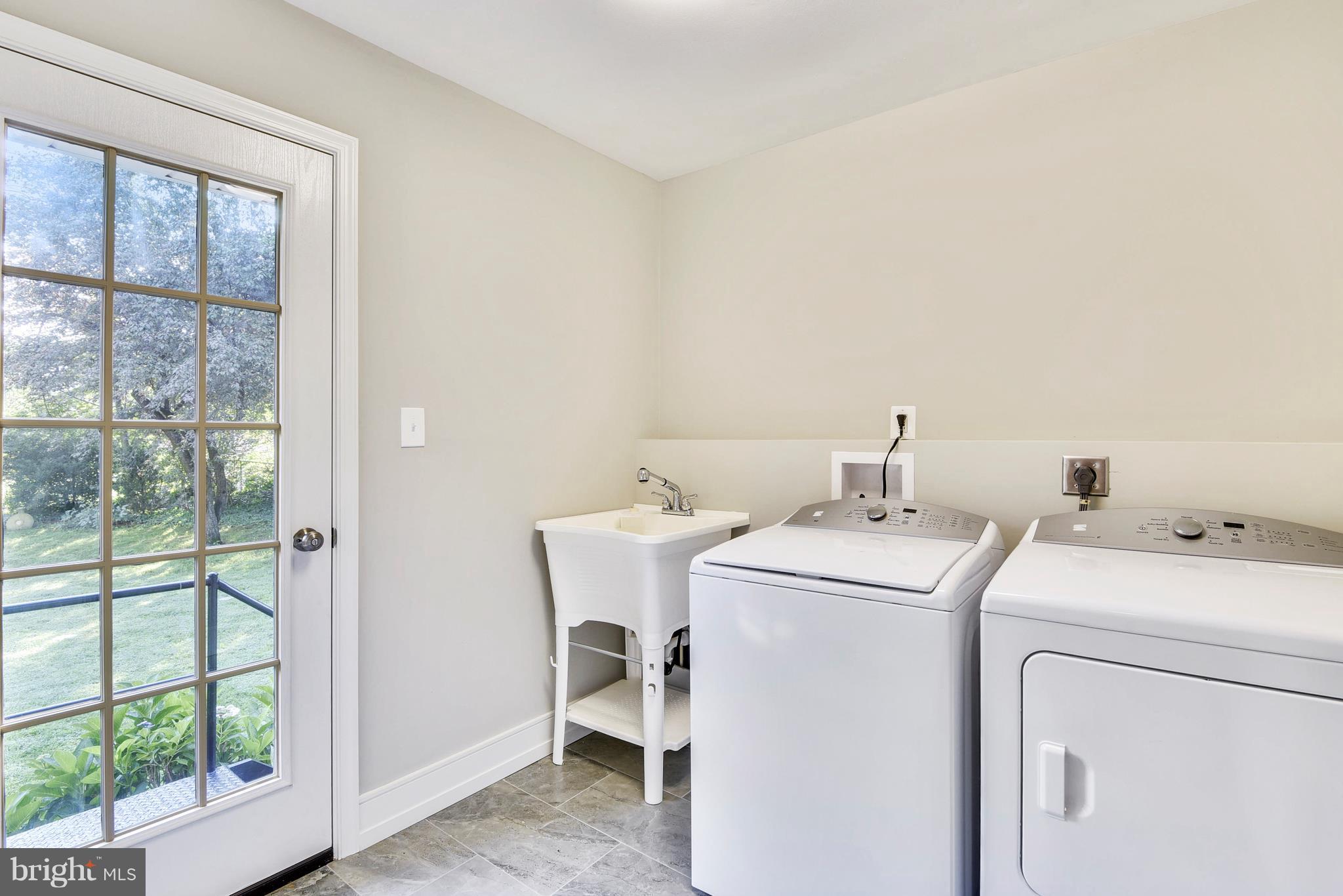 4017 Olney Laytonsville Road Olney, MD 20832 - Photo 23 of 28 a utility room with dryer and washer