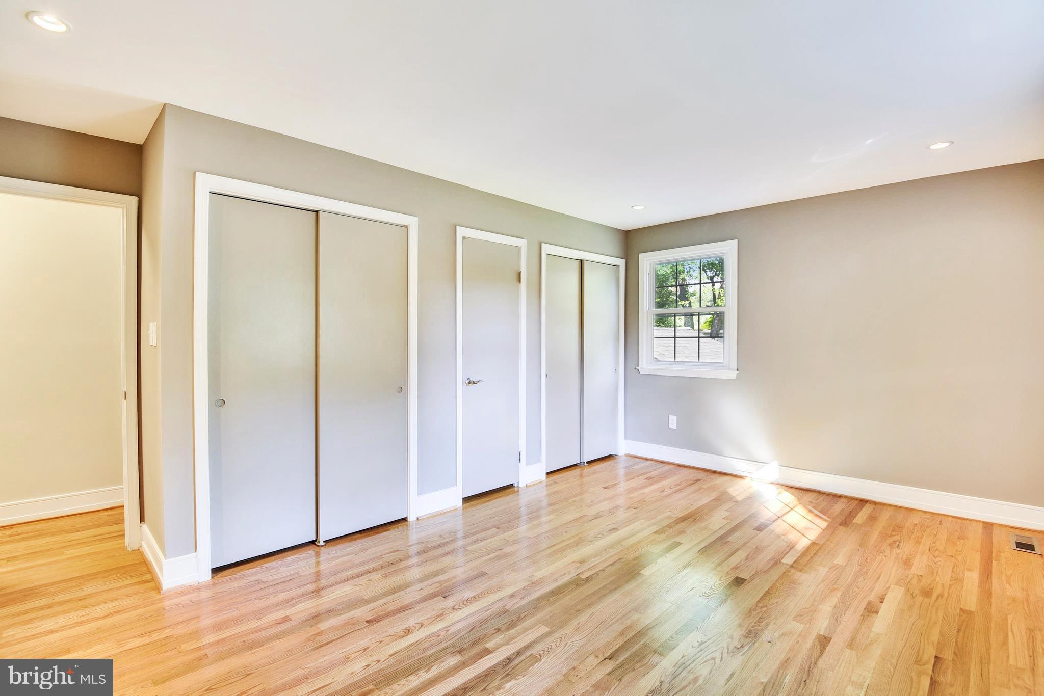 4017 Olney Laytonsville Road Olney, MD 20832 - Photo 28 of 28 a view of an empty room with wooden floor and a window