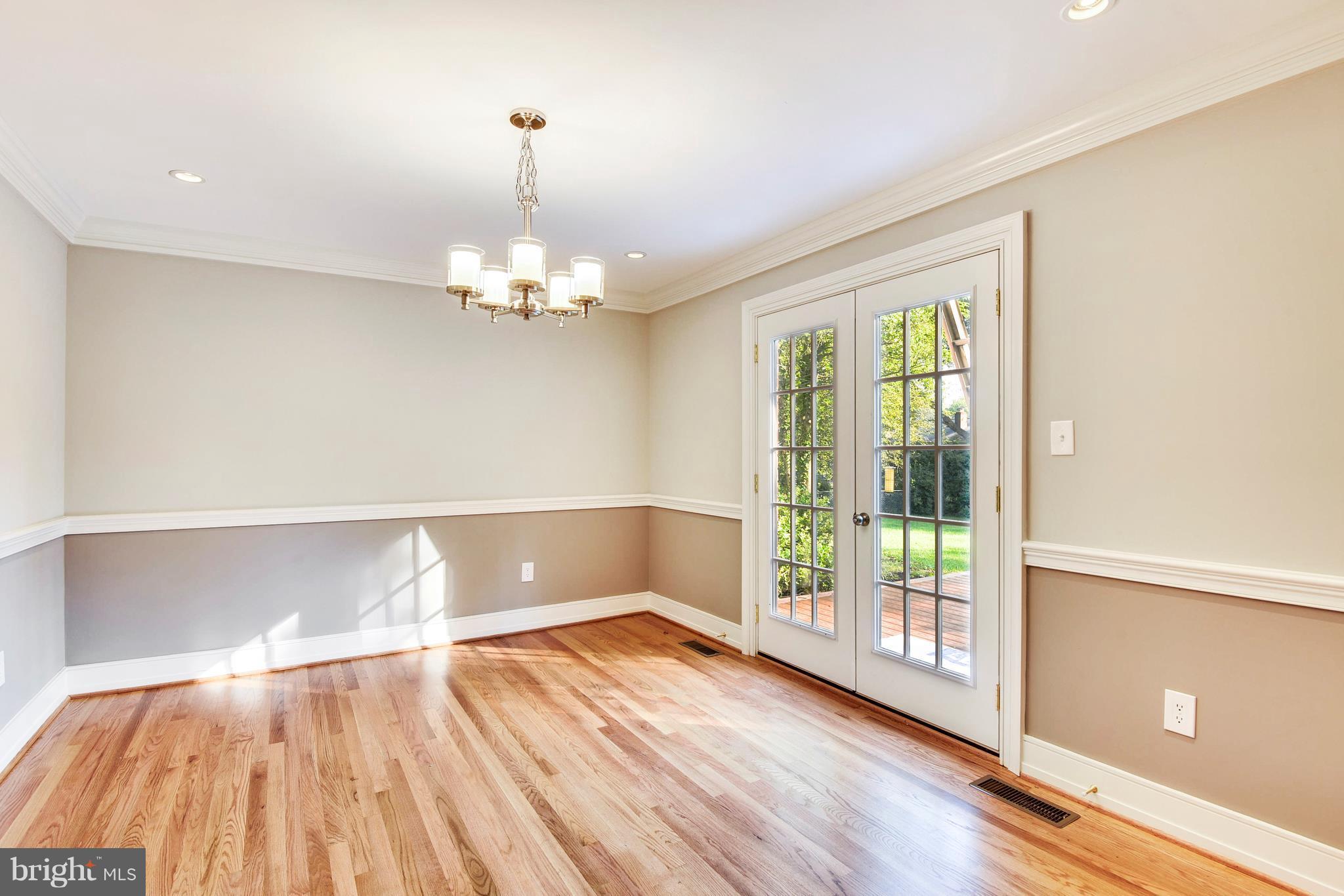 4017 Olney Laytonsville Road Olney, MD 20832 - Photo 5 of 28 a view of a room with wooden floor and fan