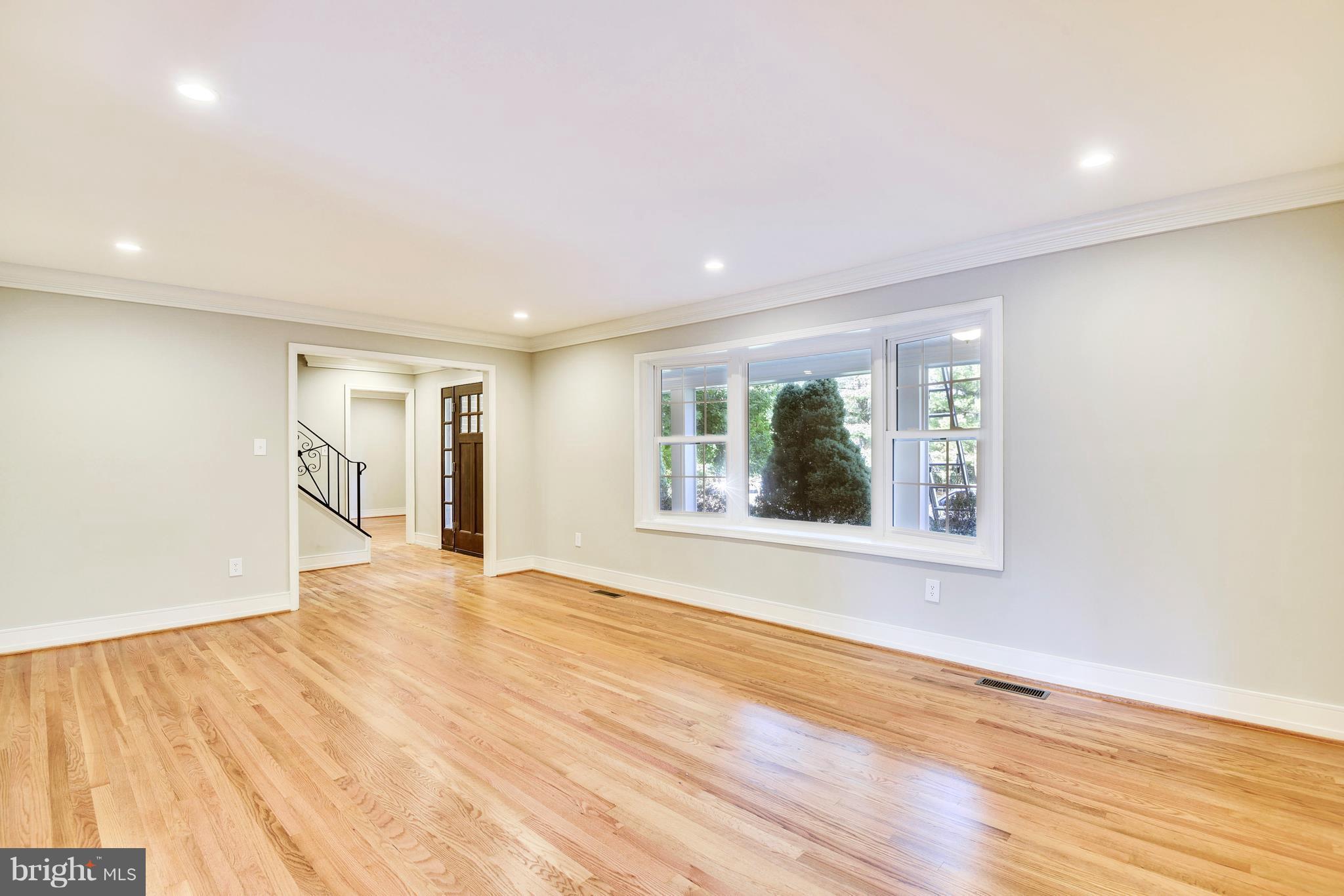 4017 Olney Laytonsville Road Olney, MD 20832 - Photo 6 of 28 a view of an empty room with wooden floor and a window