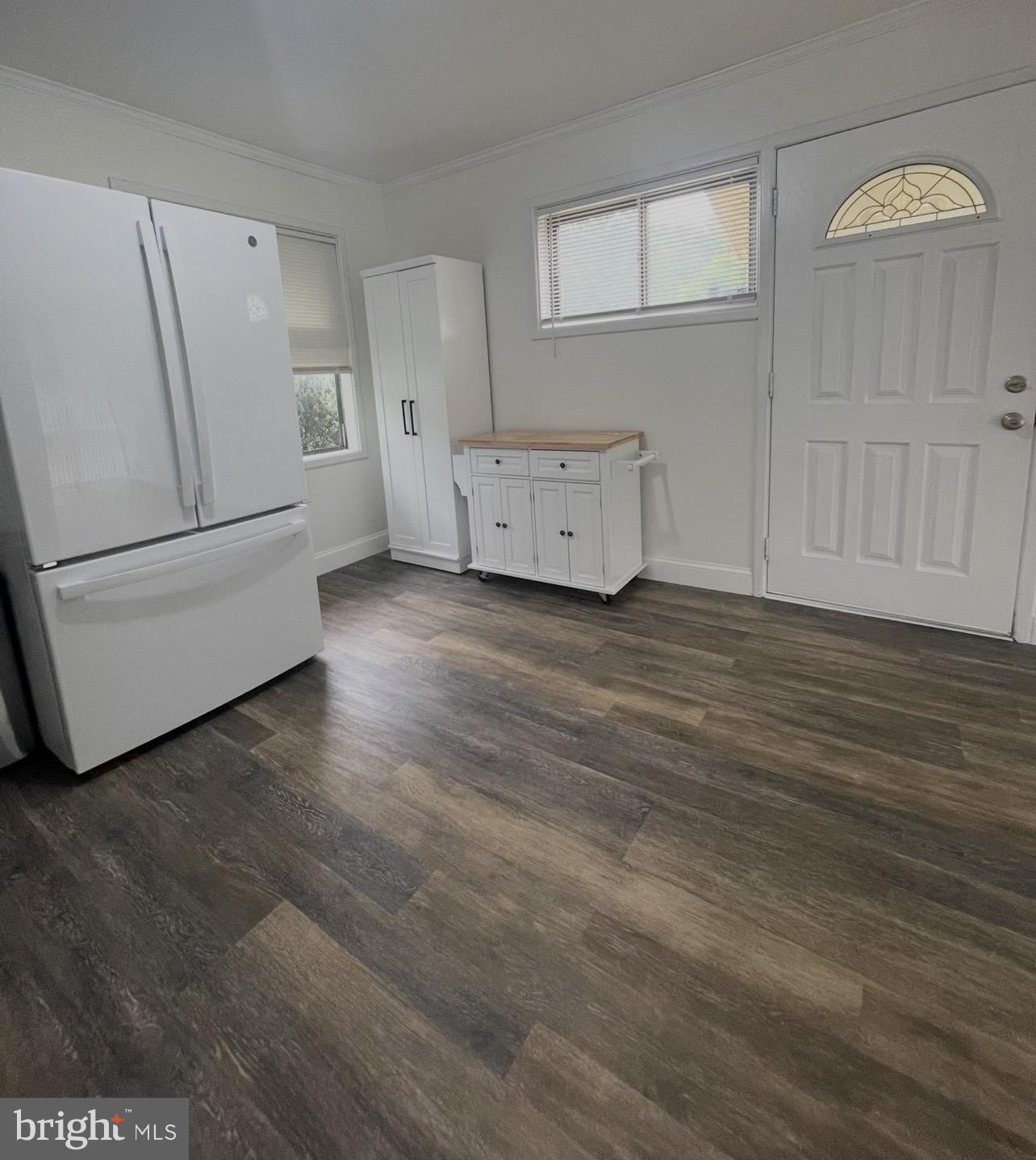 5700 Stillwell Road Rockville, MD 20851 - Photo 8 of 19 a view of a livingroom with furniture and wooden floor