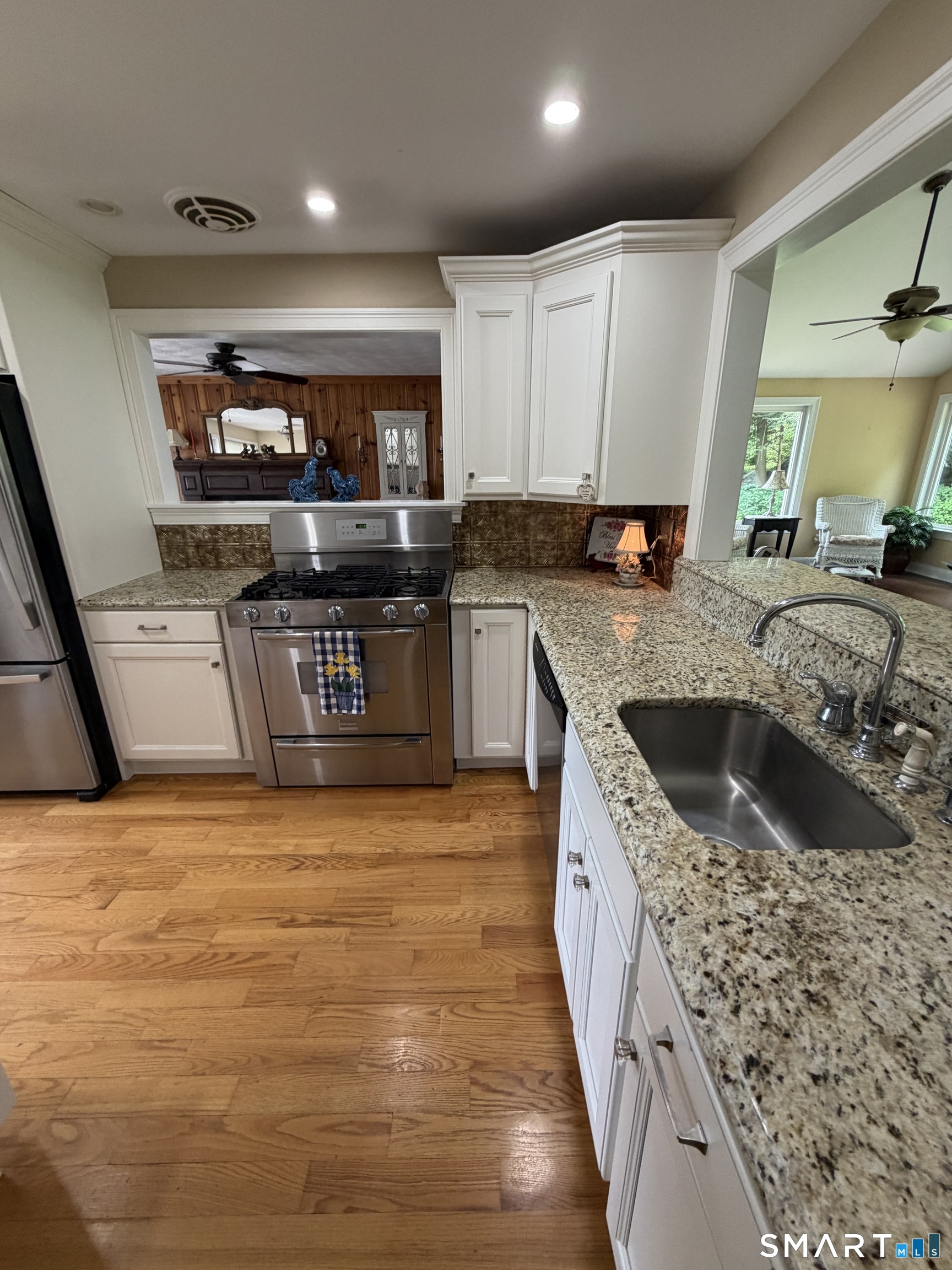109 Chasse Road Wolcott, CT 06716 - Photo 7 of 22 a kitchen with stainless steel appliances granite countertop a sink stove and refrigerator