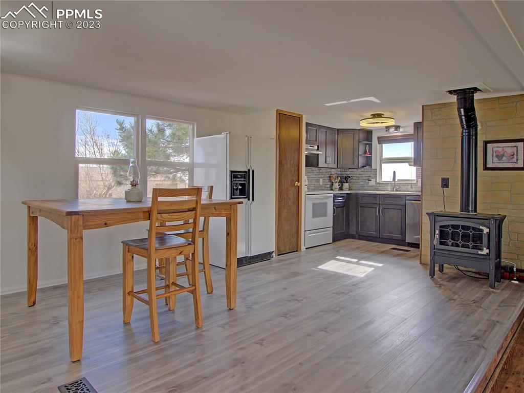 28850 Funk Road Calhan, CO 80808 - Photo 12 of 42 a dining room with furniture and wooden floor