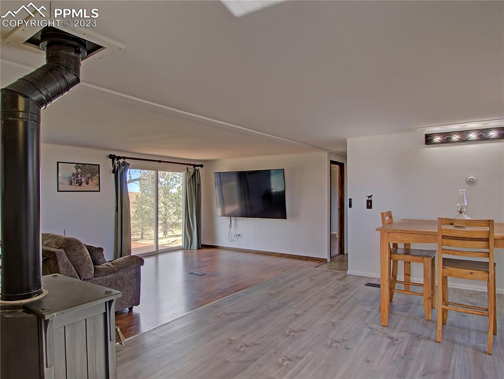 28850 Funk Road Calhan, CO 80808 - Photo 14 of 42 a view of a livingroom with furniture and a flat screen tv