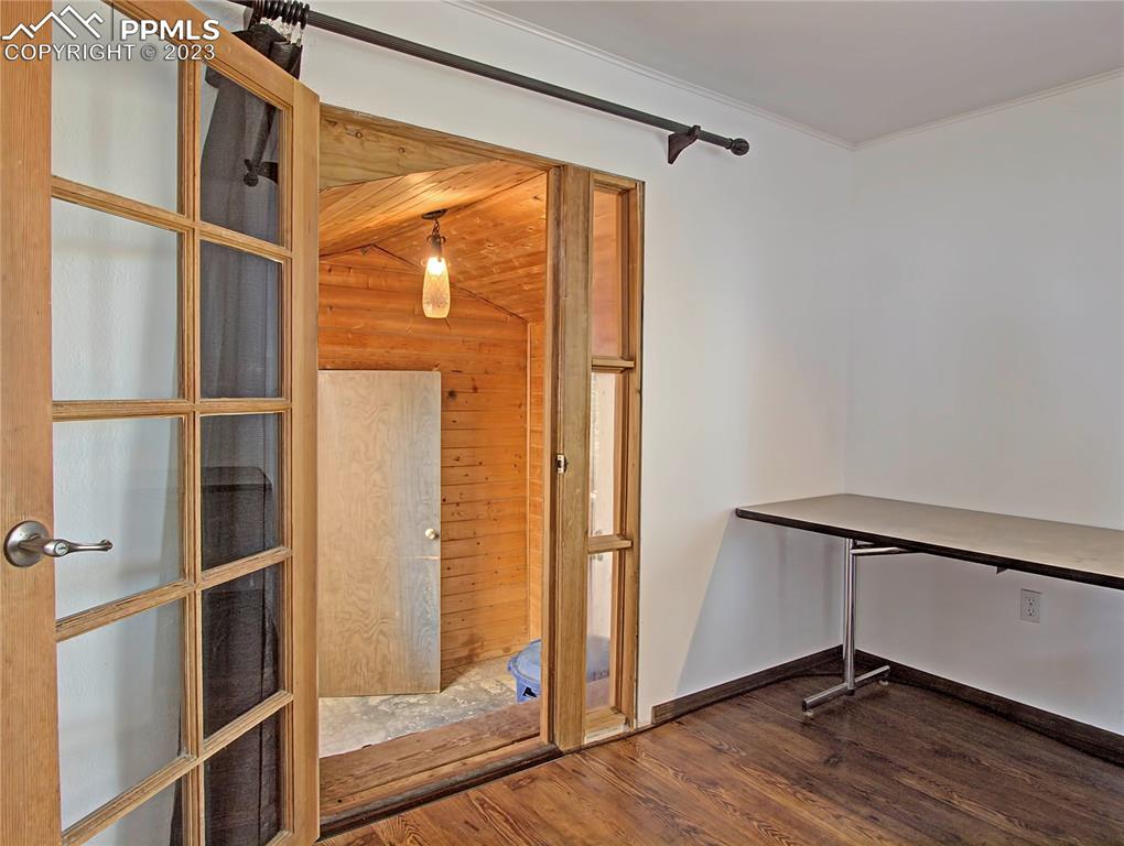 28850 Funk Road Calhan, CO 80808 - Photo 21 of 42 a view of a room with wooden floor and windows