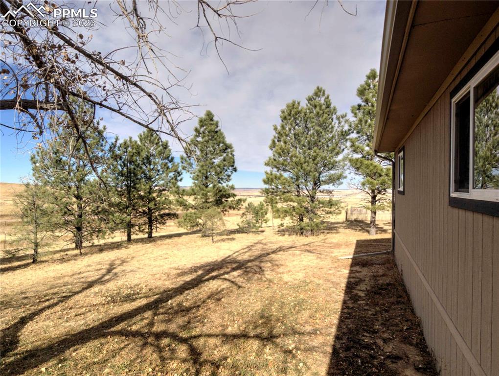28850 Funk Road Calhan, CO 80808 - Photo 23 of 42 a view of a yard covered with snow in the background