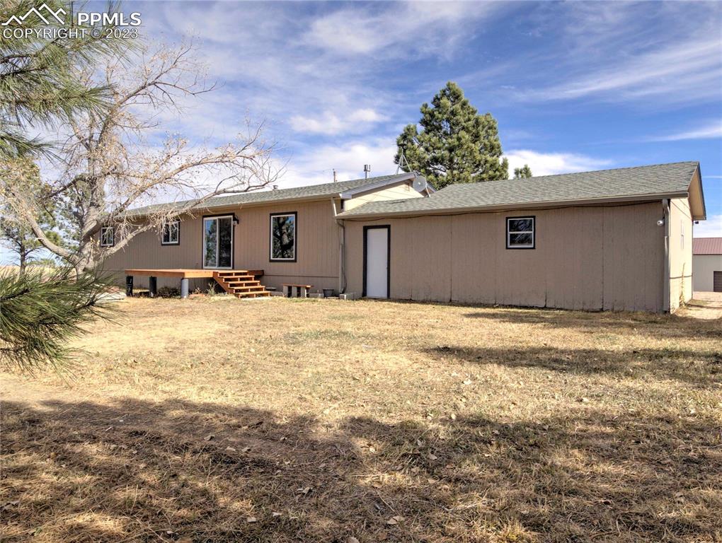 28850 Funk Road Calhan, CO 80808 - Photo 24 of 42 a view of a house with a yard