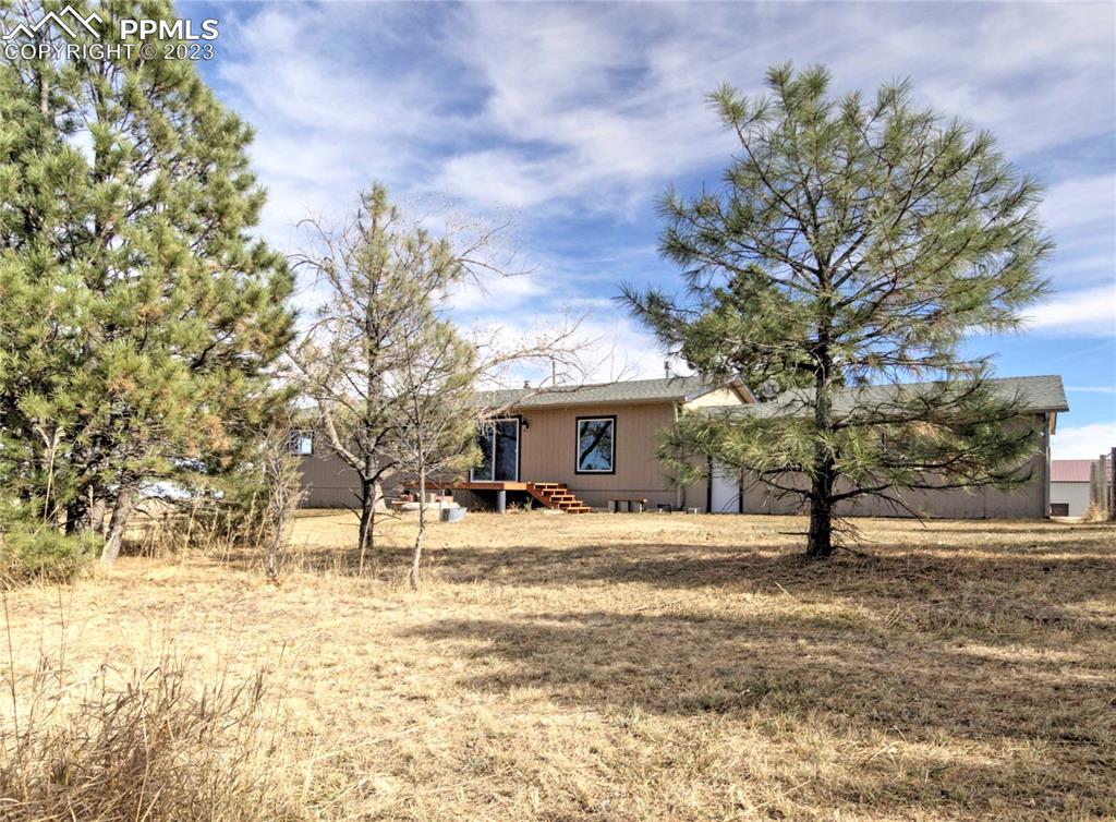 28850 Funk Road Calhan, CO 80808 - Photo 26 of 42 a view of a house with a yard covered in snow