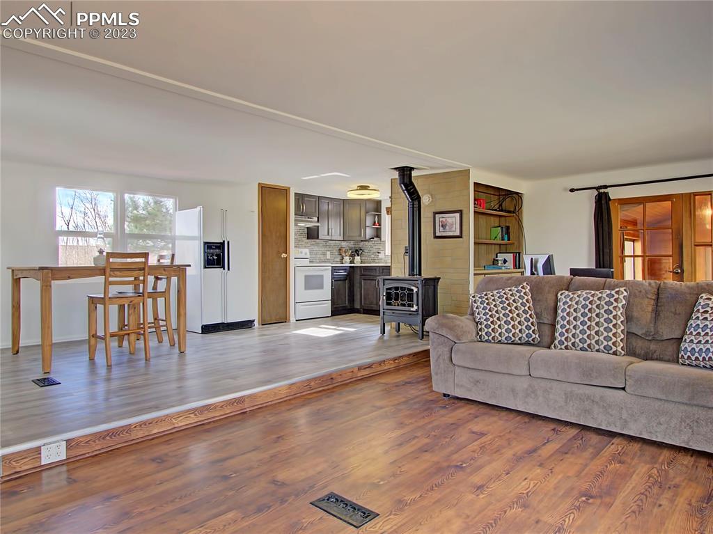 28850 Funk Road Calhan, CO 80808 - Photo 7 of 42 a living room with furniture and wooden floor