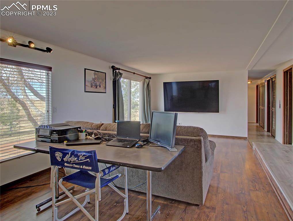 28850 Funk Road Calhan, CO 80808 - Photo 9 of 42 a work room with furniture and a flat screen tv