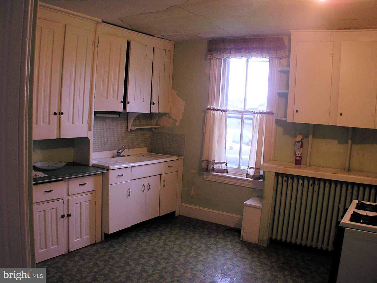 120 Scarlet Road Kennett Square, PA 19348 - Photo 12 of 25 a kitchen with granite countertop a sink window and cabinets