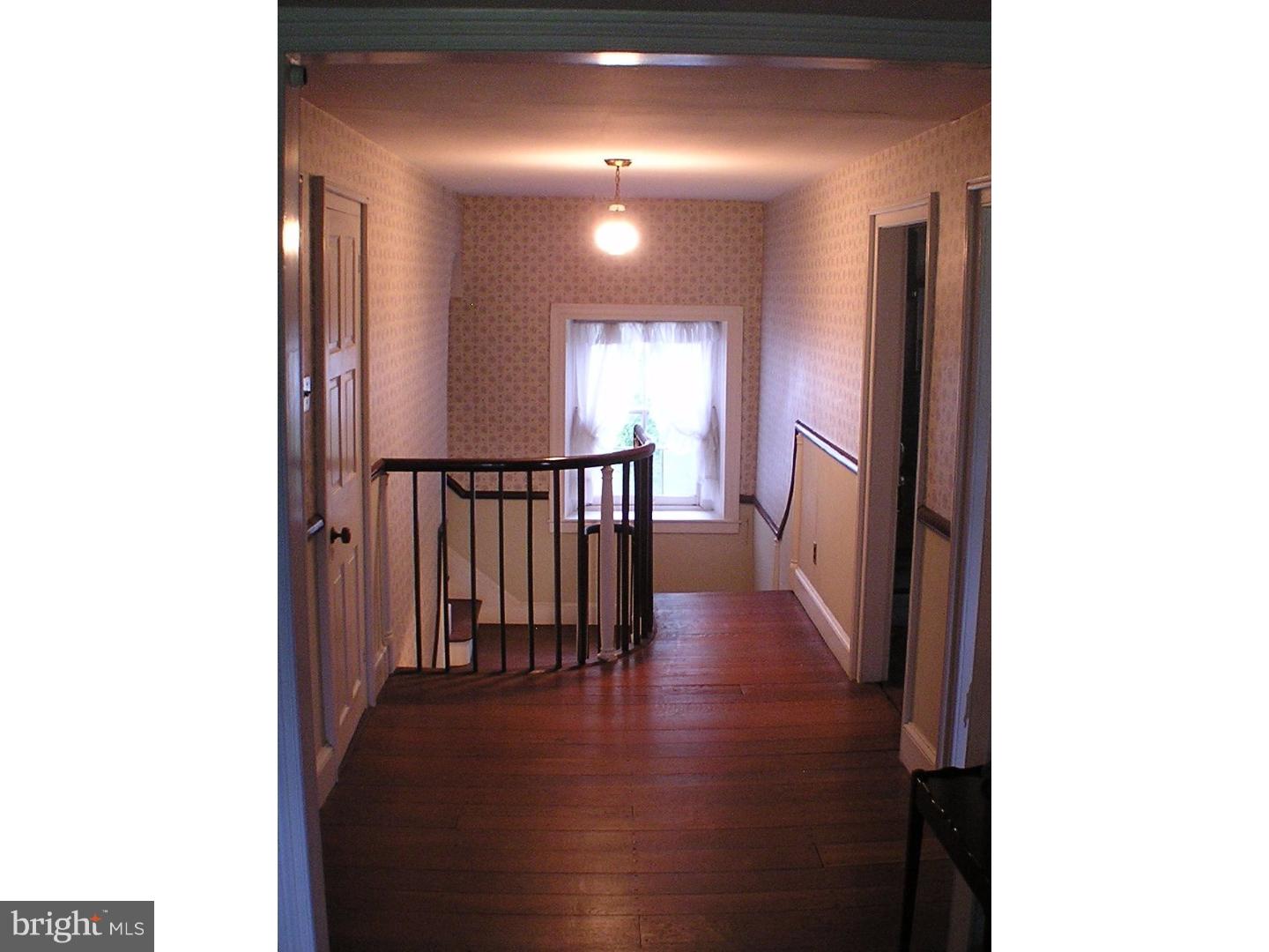 120 Scarlet Road Kennett Square, PA 19348 - Photo 14 of 25 a view of a hallway with the wooden floor
