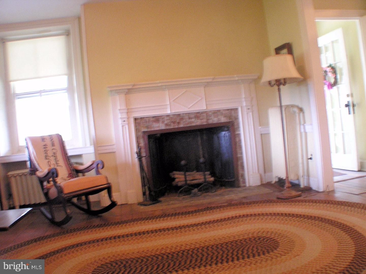 120 Scarlet Road Kennett Square, PA 19348 - Photo 6 of 25 a living room with furniture and a fireplace
