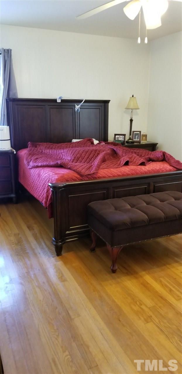 3909 Buffaloe Road Raleigh, NC 27604 - Photo 10 of 11 a bedroom with a bed and window