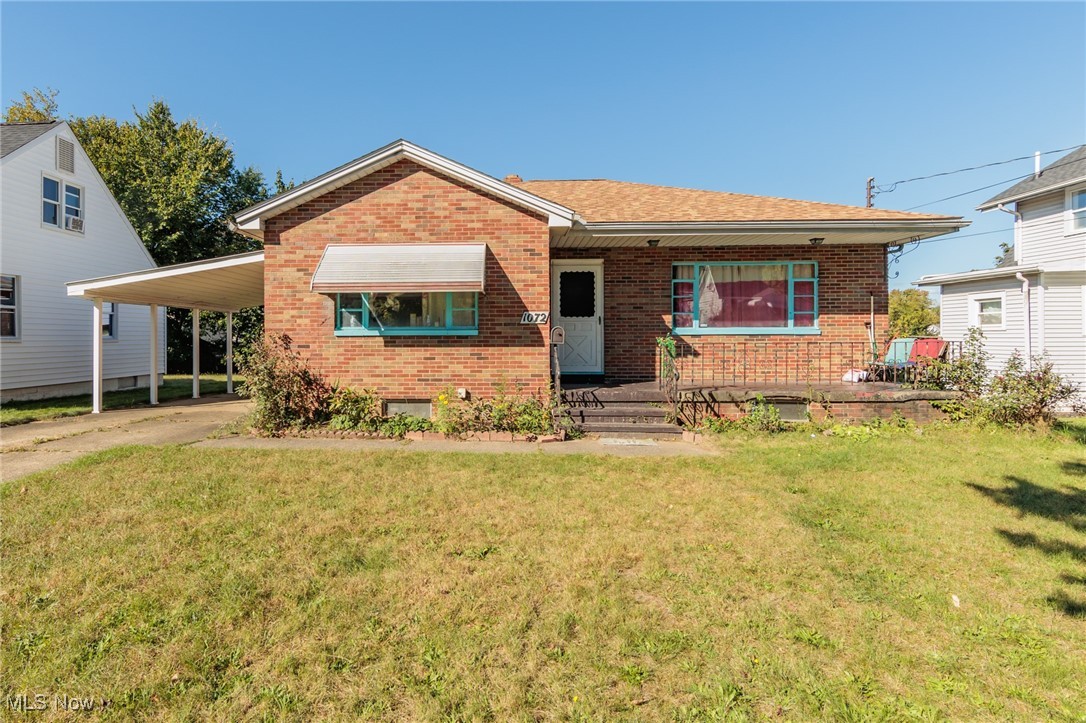 1072 Dayton Street Akron, OH 44310 - Photo 1 of 1 View of front of property featuring a front yard and a carport