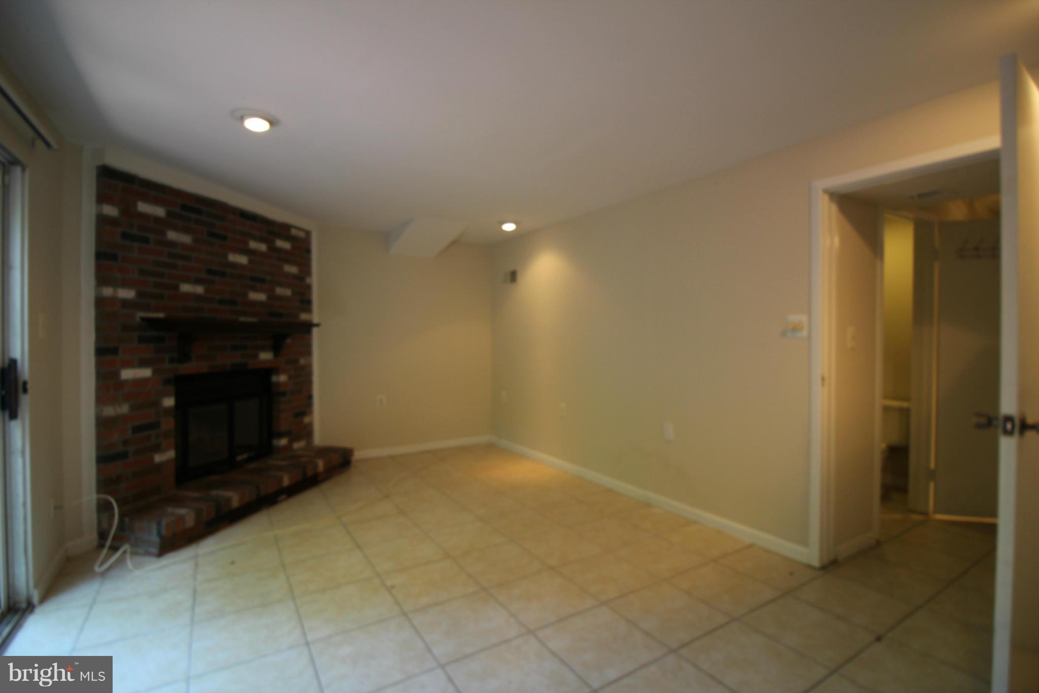 6266 Hillside Road Springfield, VA 22152 - Photo 24 of 29 a view of an empty room with a fireplace