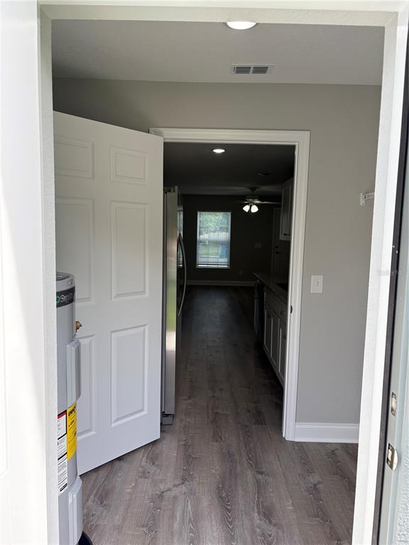 520 2nd Street Southwest Fort Meade, FL 33841 - Photo 11 of 21 a view of a hallway view with wooden floor and staircase