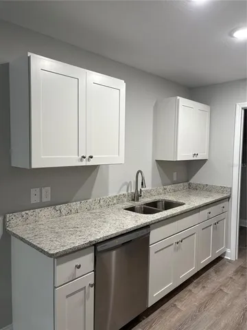 a kitchen with a sink and cabinets
