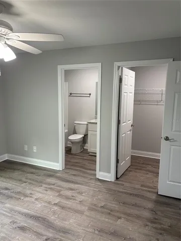 a view of a bathroom with wooden floor