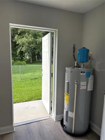 a view of open door and garden