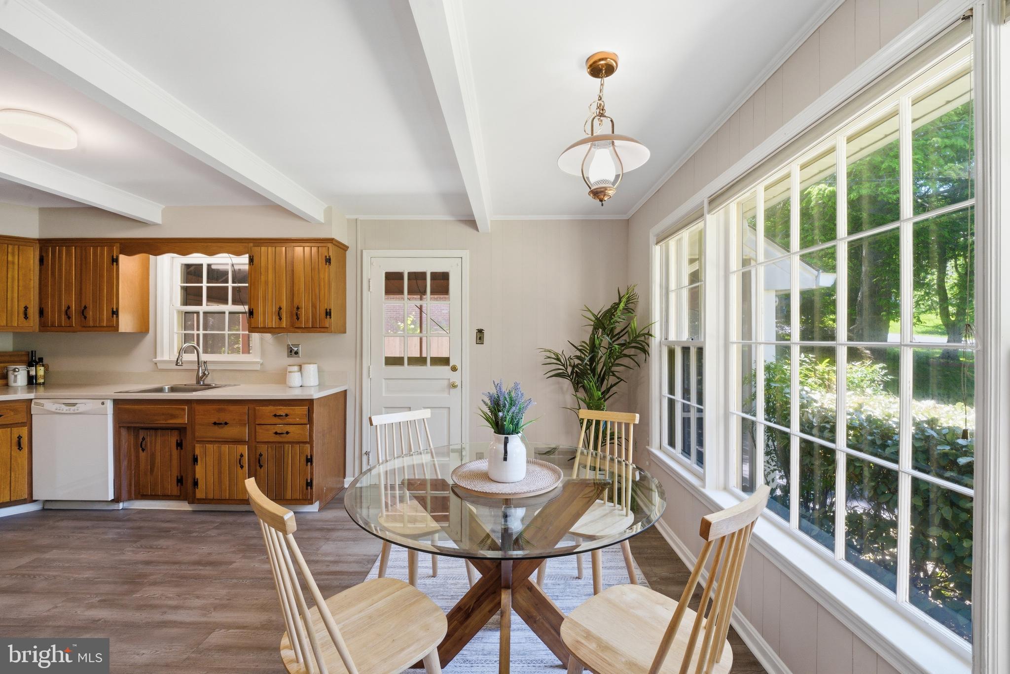 13309 Old Forge Road Silver Spring, MD 20904 - Photo 13 of 52 a view of a dining room with furniture a chandelier and wooden floor