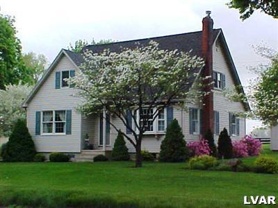 front view of a house with a yard