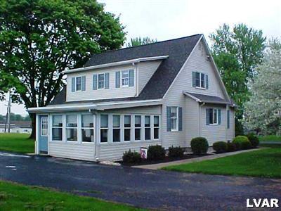3124 Newburg Road Nazareth, PA 18064 - Photo 2 of 5 a front view of a house with a garden