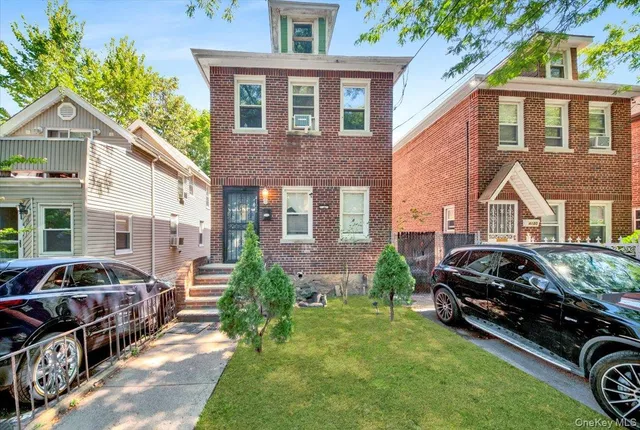 a view of a car parked in front of a house