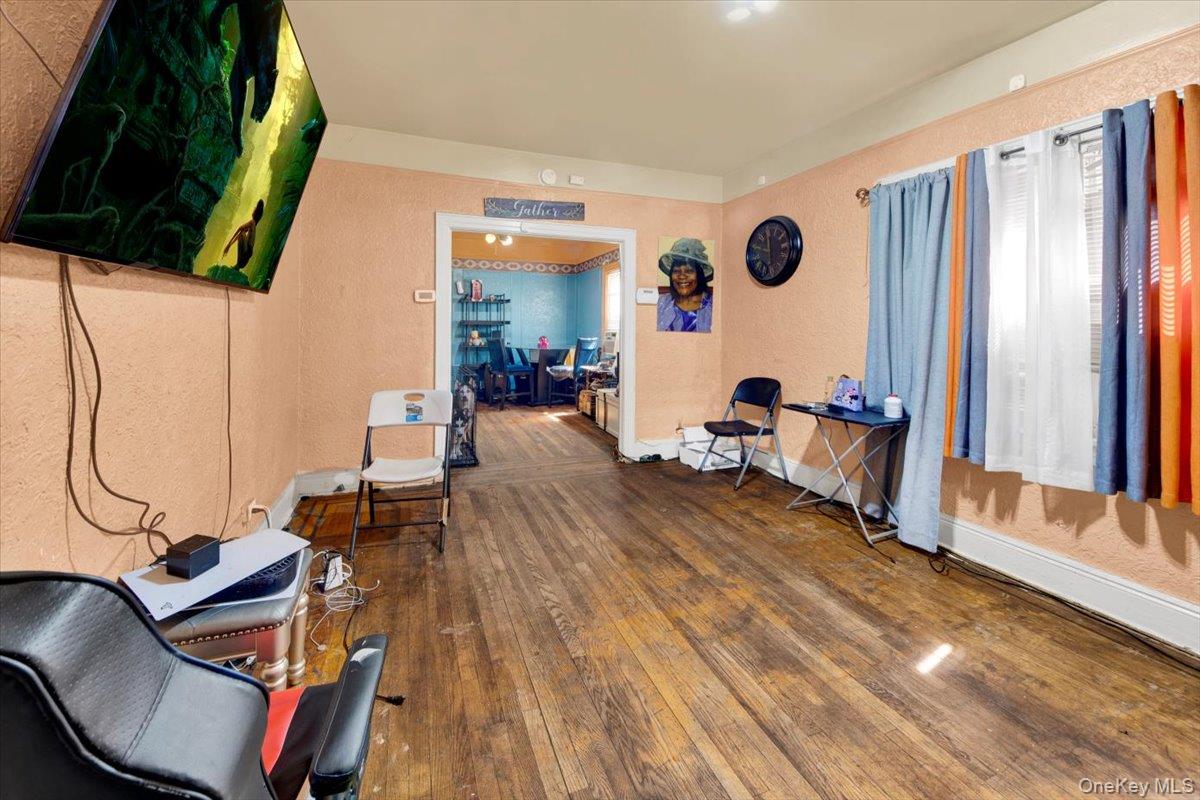 4122 Wickham Avenue Bronx, NY 10466 - Photo 2 of 10 a living room with furniture and a wooden floor