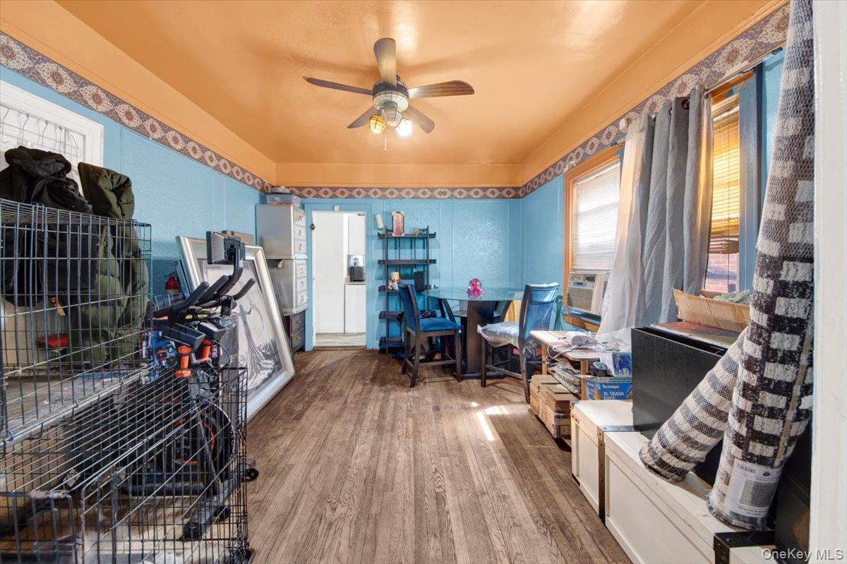 4122 Wickham Avenue Bronx, NY 10466 - Photo 4 of 10 a view of a livingroom with furniture gym equipment