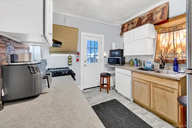 a kitchen with stainless steel appliances kitchen island granite countertop a refrigerator and a stove top oven