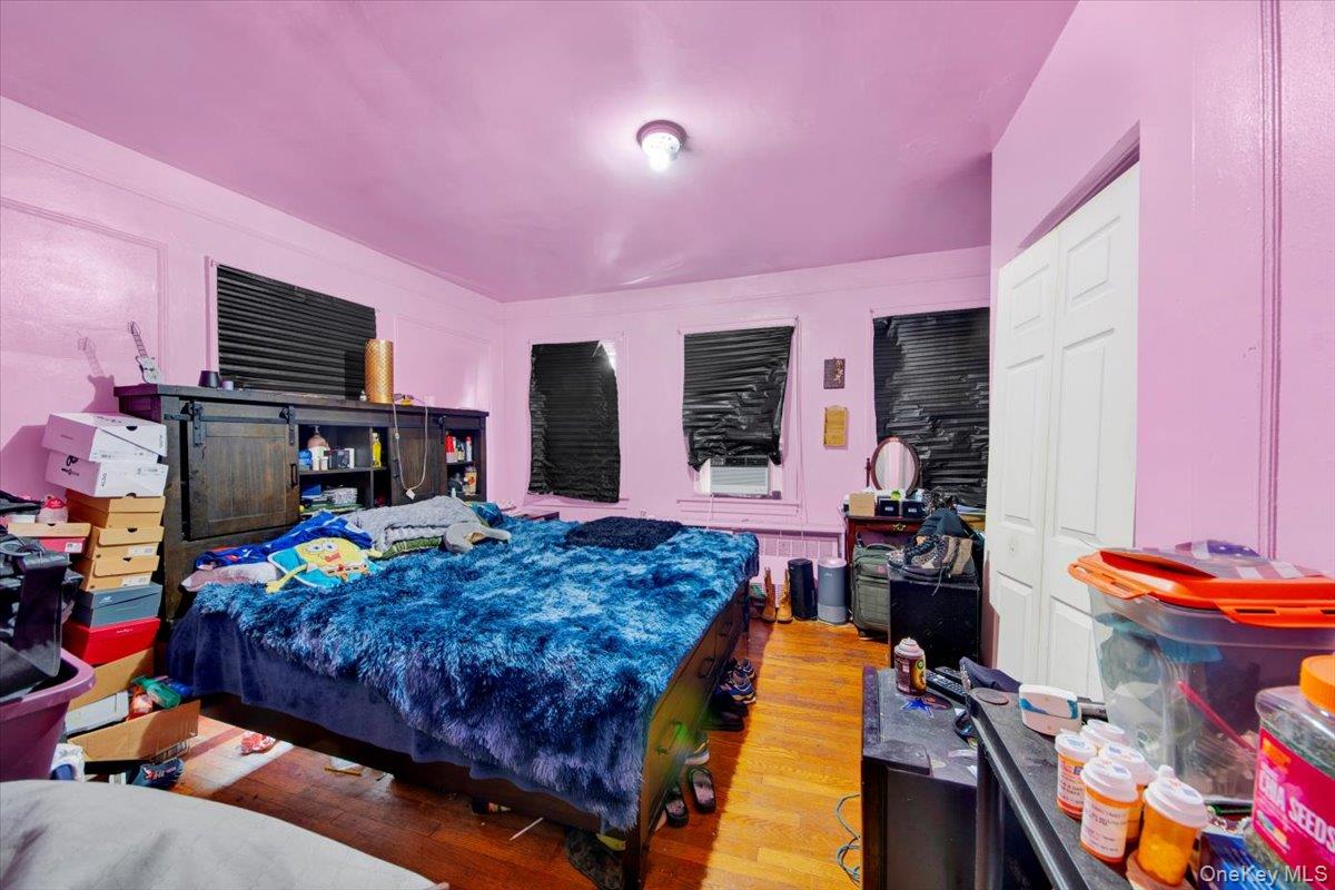 4122 Wickham Avenue Bronx, NY 10466 - Photo 8 of 10 a bed room with a bed and a television