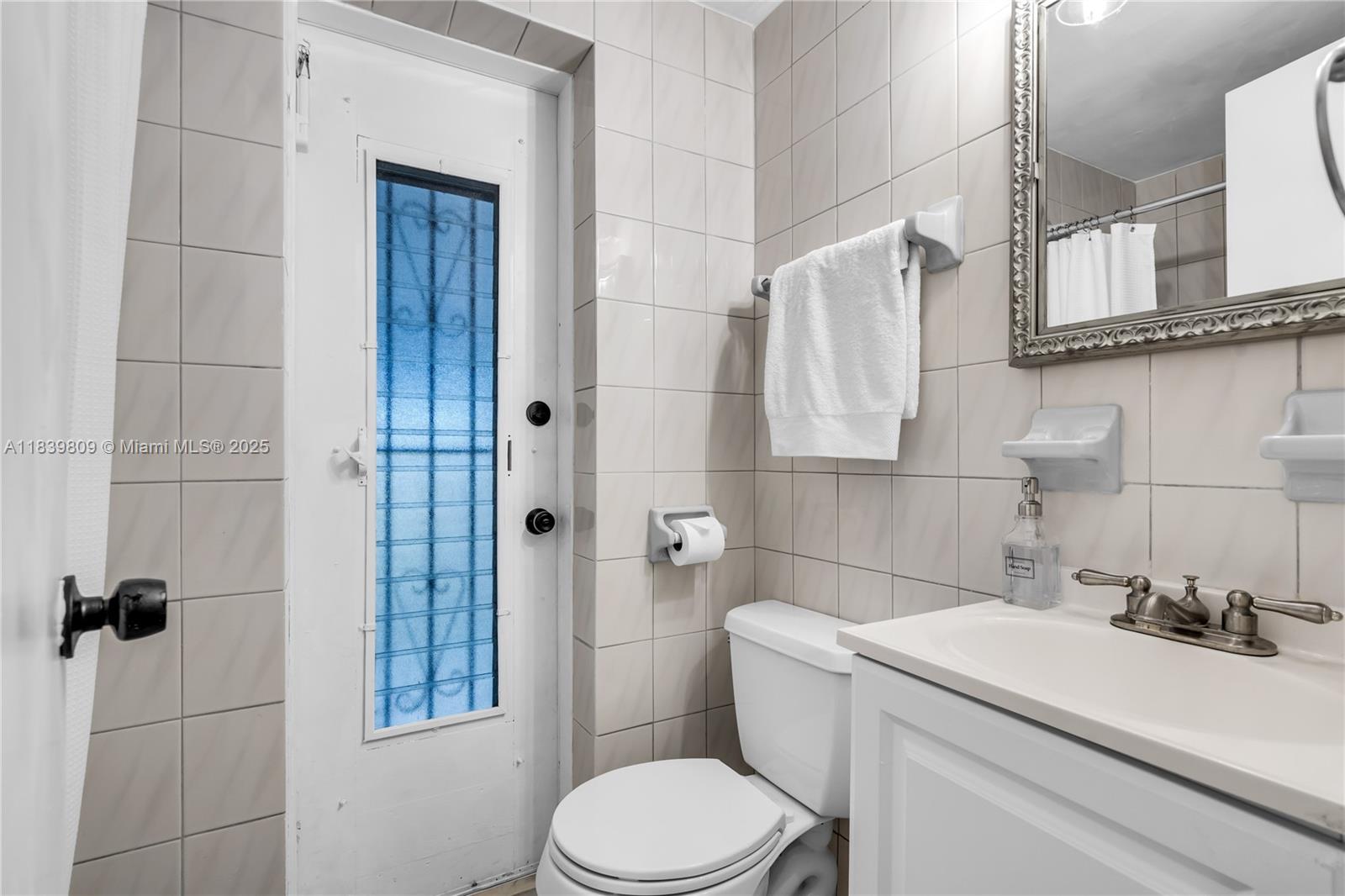 2121 Southwest 13th Avenue Miami, FL 33145 - Photo 12 of 43 a bathroom with a sink toilet and shower