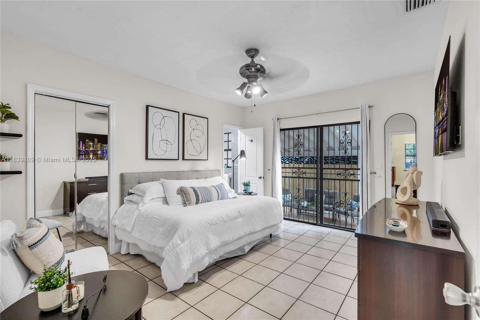 2121 Southwest 13th Avenue Miami, FL 33145 - Photo 15 of 43 a bed room with a bed and a chandelier