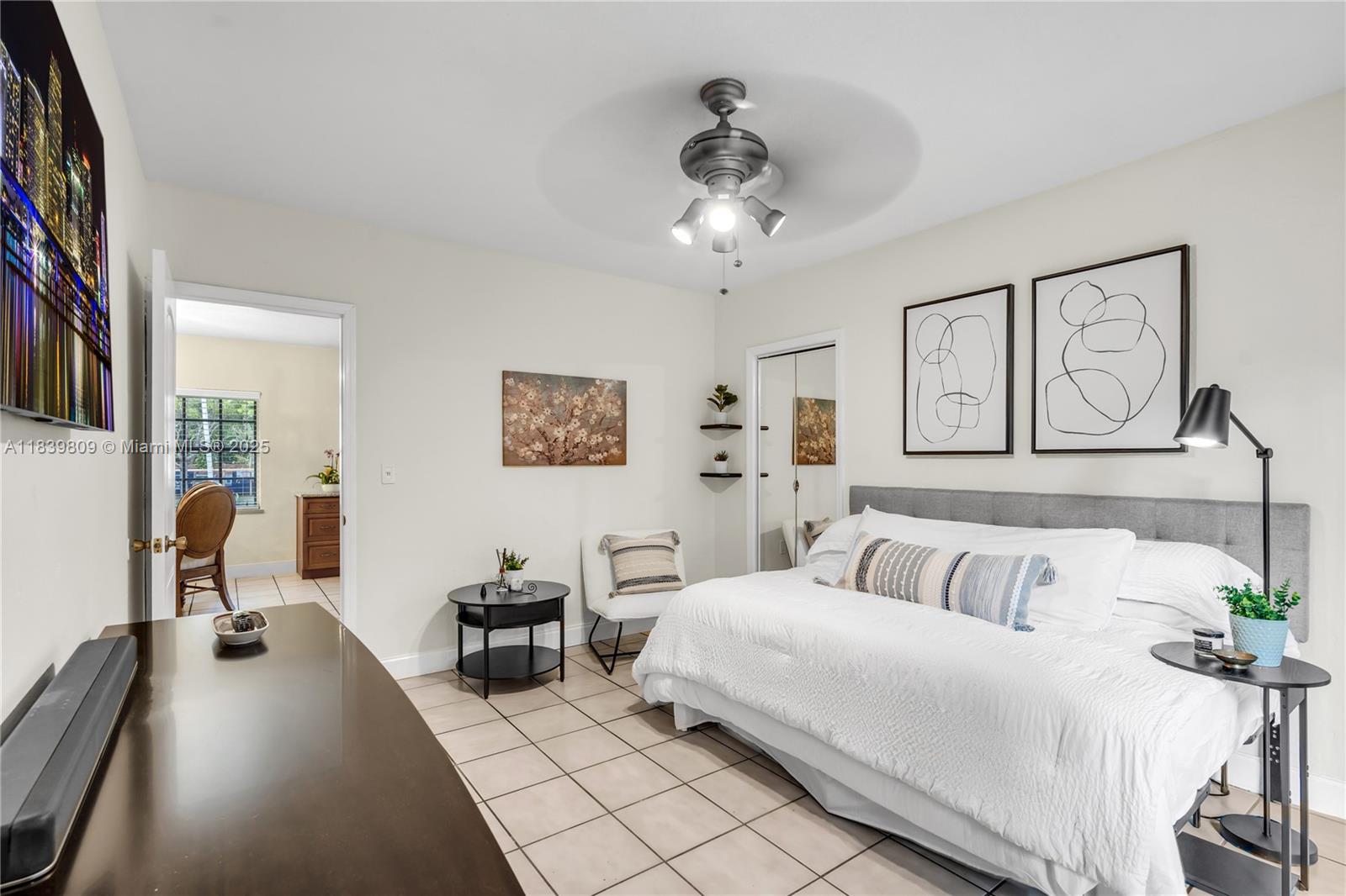 2121 Southwest 13th Avenue Miami, FL 33145 - Photo 17 of 43 a bedroom with a bed and wooden floor