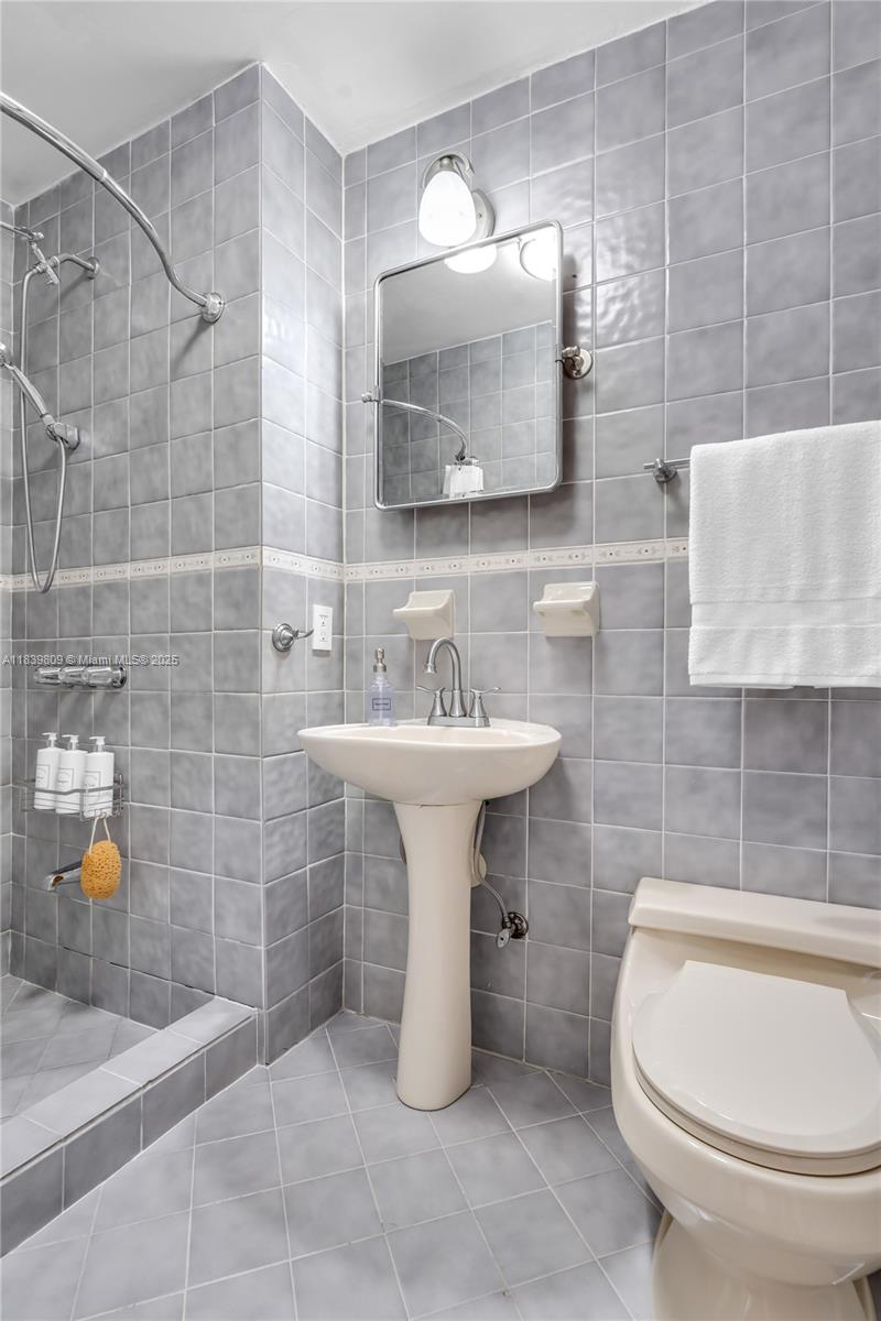 2121 Southwest 13th Avenue Miami, FL 33145 - Photo 18 of 43 a bathroom with a sink toilet and shower