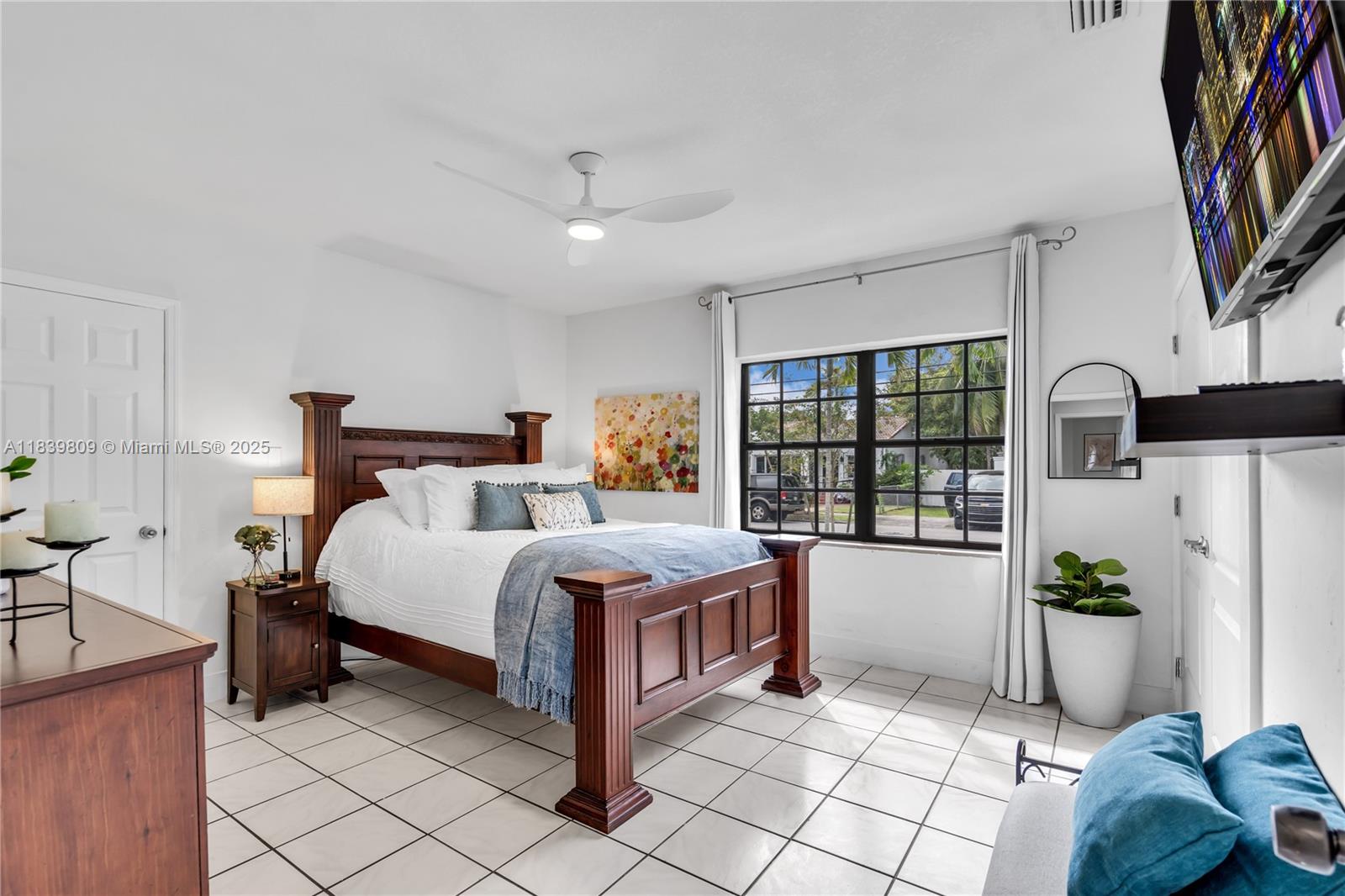2121 Southwest 13th Avenue Miami, FL 33145 - Photo 19 of 43 a bed room with a bed and a potted plant