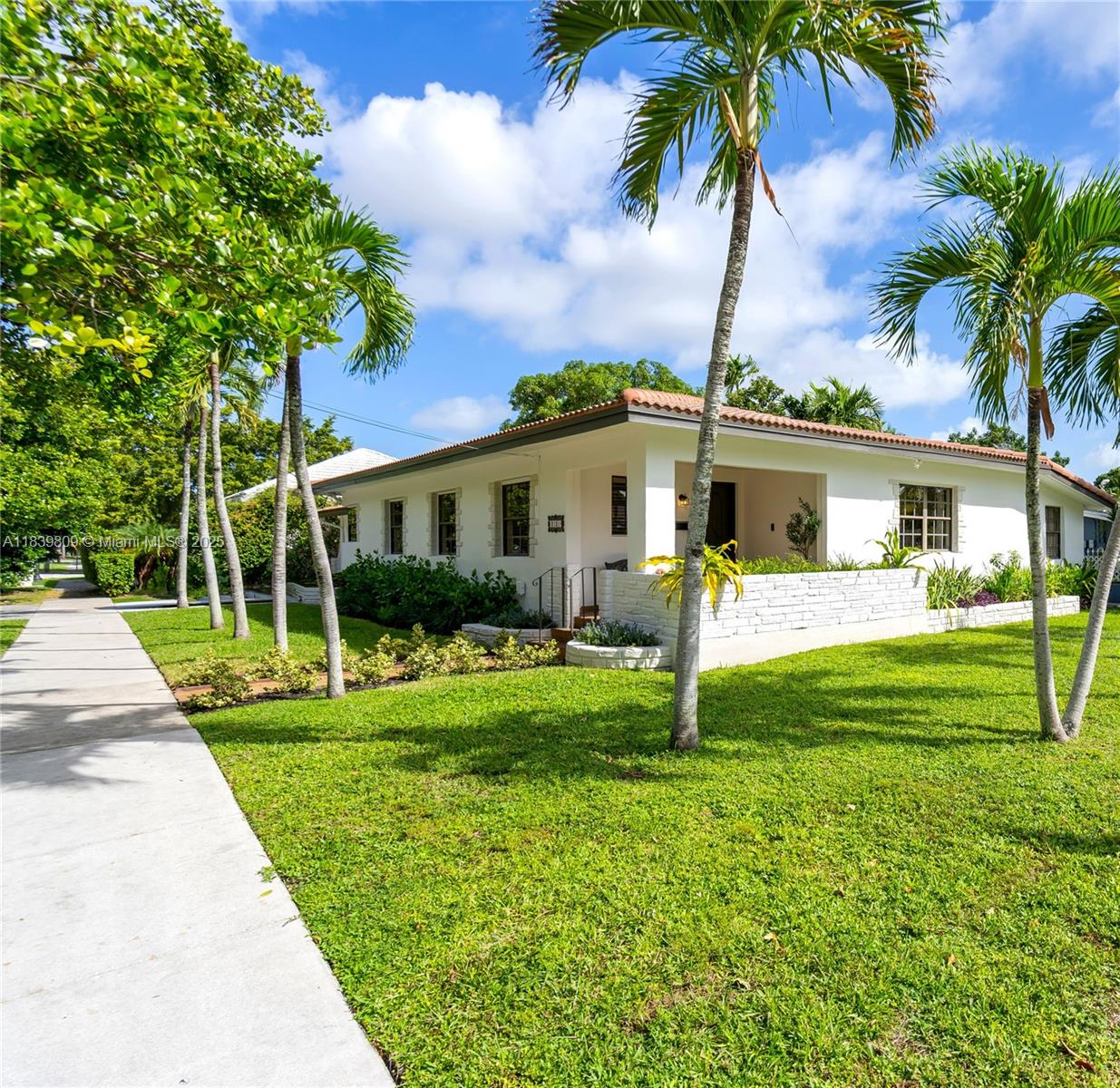 2121 Southwest 13th Avenue Miami, FL 33145 - Photo 2 of 43 a front view of a house with garden